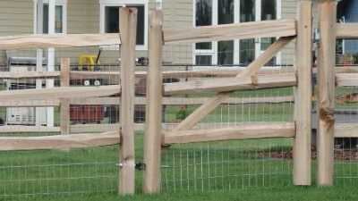 cedar split rail fence with galvanized welded wire mesh installed in Columbus Ohio.
