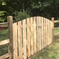double picket fence gate installed in split rail fence in columbus OH