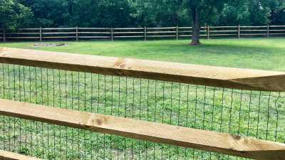 split rail fence with vinyl coated welded wire installed in Columbus Ohio.